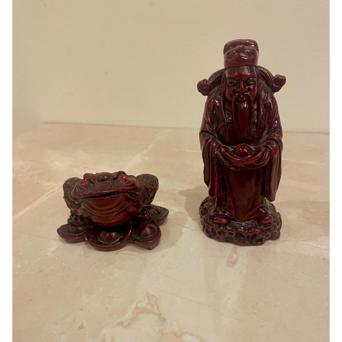 45 - Two decorative Chinese figures,  a Feng Shui money frog and a Fu Lu Shou figure. Resin.