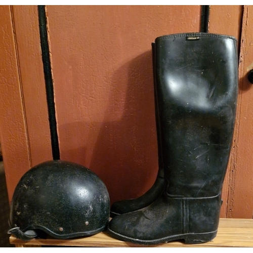 293 - Riding boots and a riding helmet