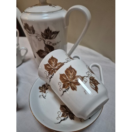 161 - German porcelain coffee set. Mint vintage condition. Brown leaf and vine pattern on white background... 