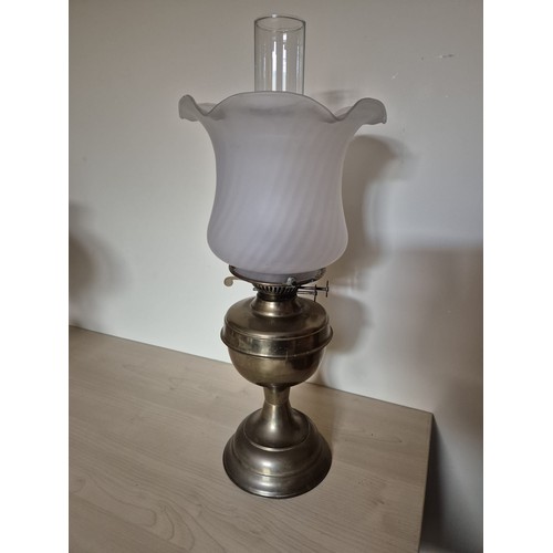 162 - Vintage brass oil lamp with wick mechanism. Glass chimney intact.