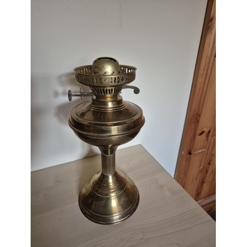 162 - Vintage brass oil lamp with wick mechanism. Glass chimney intact.