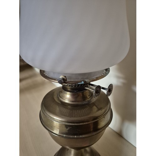 163 - Vintage brass oil lamp with frosted glass shade. Glass chimney and wick mechanism intact.