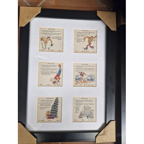 92 - Three good Guinness displays depicting various series of beer mats.