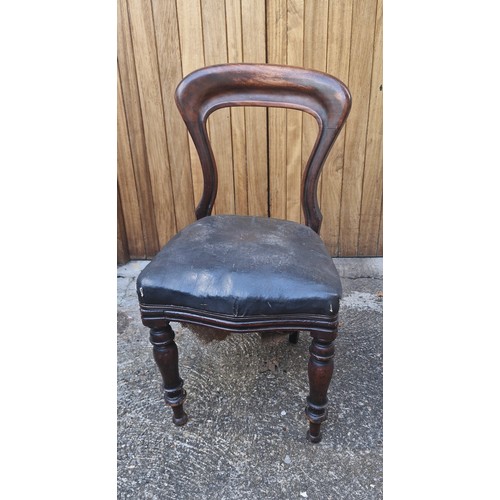 110 - A Victorian balloon back chair.