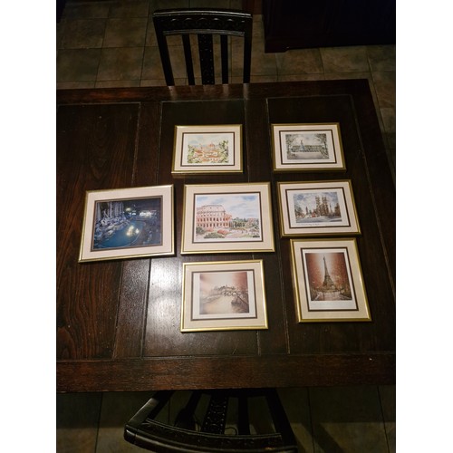112 - a selection of 7 items of wall art - European scenes.