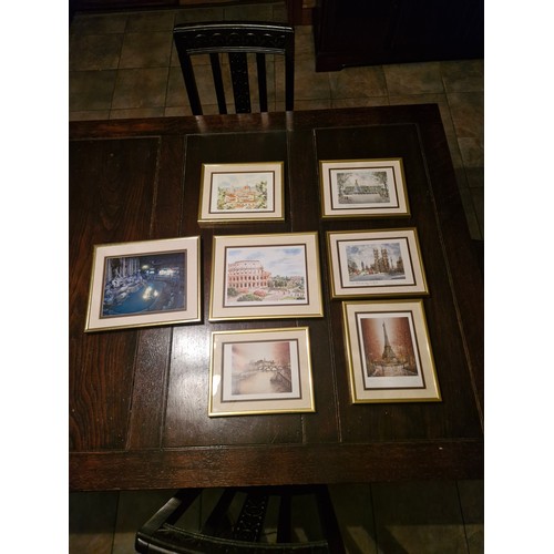 112 - a selection of 7 items of wall art - European scenes.