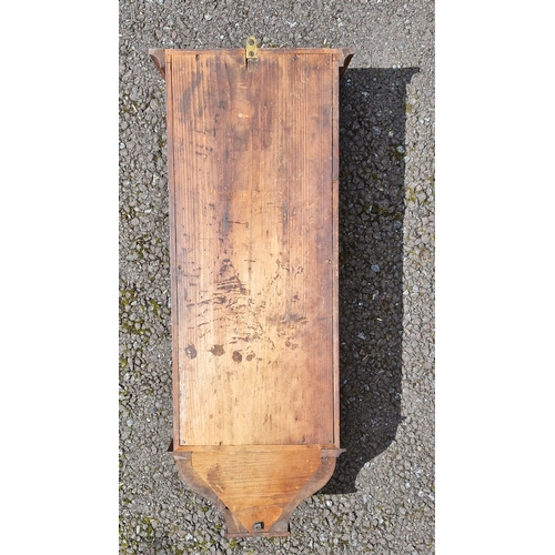 139 - Late 1800s clock in a walnut case with scrolled top.