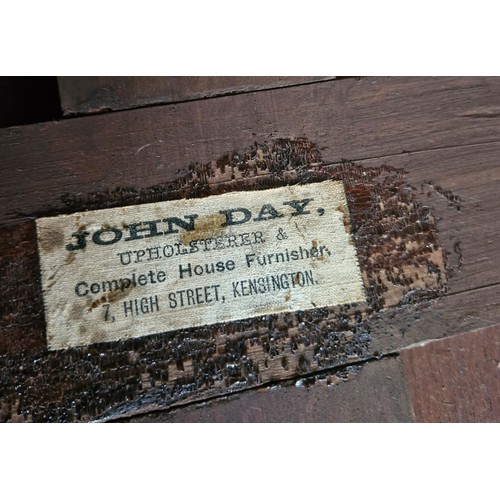 50 - A 1800s walnut octagonal occasional table with a gallery shelf, bearing the stamp