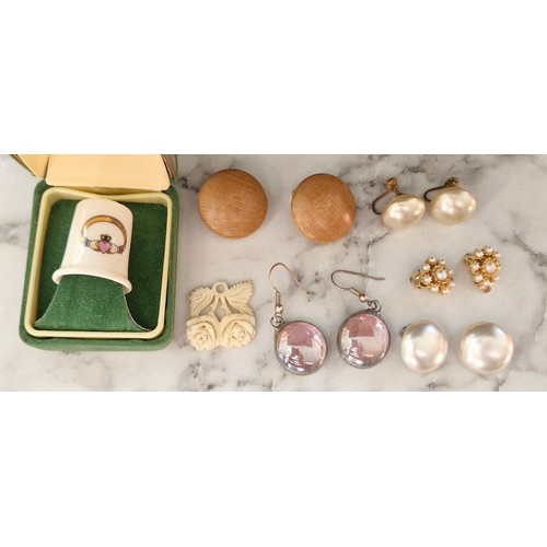 16 - Costume jewellery  -  a selection of earrings and a parian ware Donegal thinble.