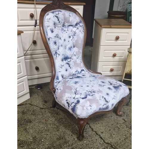95 - An upholstered Victorian nursing chair.