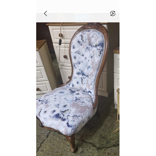 95 - An upholstered Victorian nursing chair.