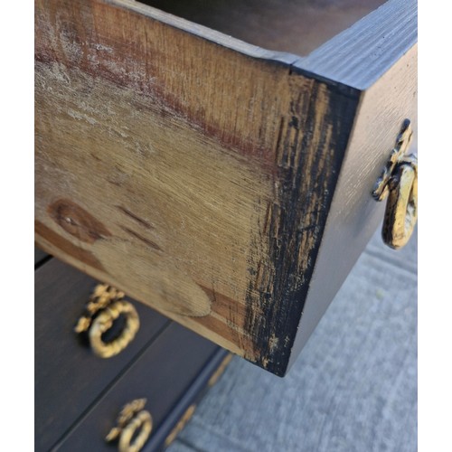 97 - An early 1900s oak carved bureau with black and gold decorative features
