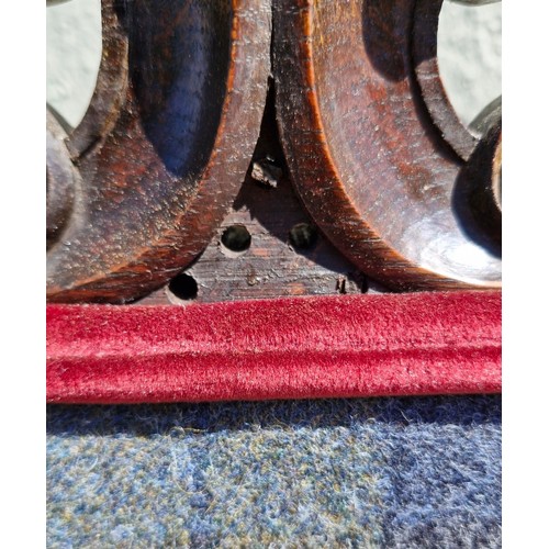 100 - A Jacobean style mahogany carver armchair with high decorative back, arm rests and stretcher. Uphols... 