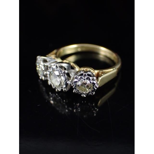 3 - A diamond three stone ring set in 18ct gold, finger size J and a half