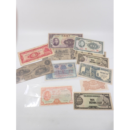 10 - A collection of bank notes, including an Irish Ten shilling note, The People's Bank of Paterson Thre... 