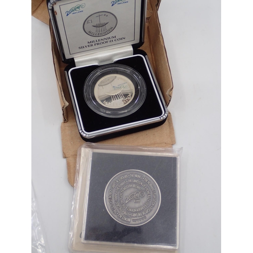 55 - A Millennium silver Â£1 coin and a silver medallion