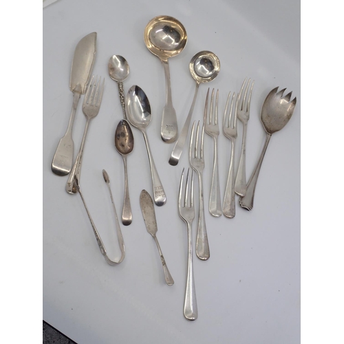 195 - A collection of silver flat ware approx. 556 grams and a silver plated sugar tongs