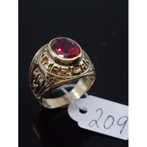 209 - A gents gold college style ring with a red stone, approx. 11.8 grams finger size T