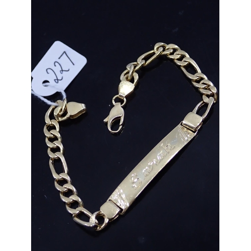 227 - An 18ct gold identity bracelet approx. 10.9 grams engraved 'Sarah' length 8 inches