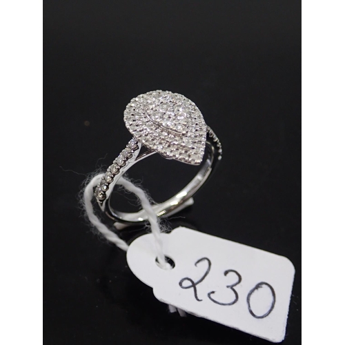 230 - A ladies white gold diamond cluster ring, total estimated weight of diamonds 0.50cts finger size K