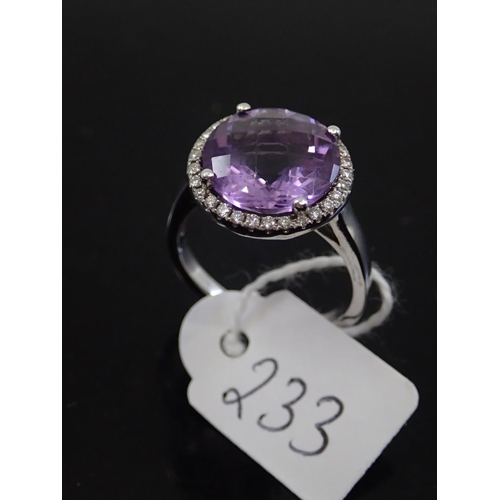 233 - An 18ct white gold amethyst cluster ring, approx. 5.8 grams, finger size P