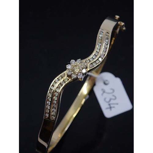 234 - A ladies gold diamond set bangle approx. 14.4 grams