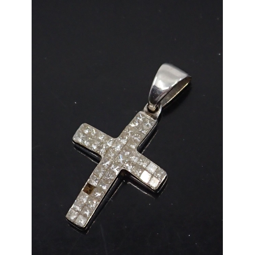 24 - A 14kt diamond set cross (missing one diamond) approx. 2.5 grams, and a gem set gold earring