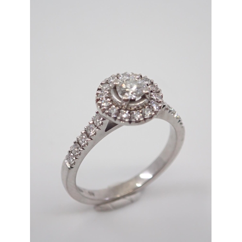 3 - A halo diamond cluster ring set in 18ct gold finger size M