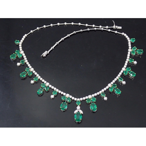 35 - A fine emerald and diamond necklace set in 18ct gold