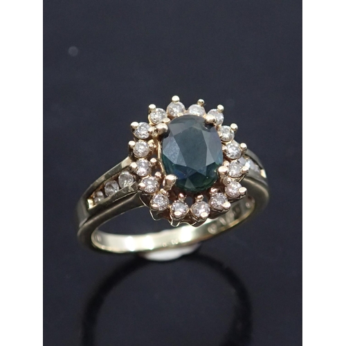 48 - A diamond and sapphire cluster ring approx. 10kt approx. 4 grams