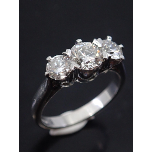 50 - A fine diamond three stone ring set in platinum with a copy of a valuation which states the total di... 