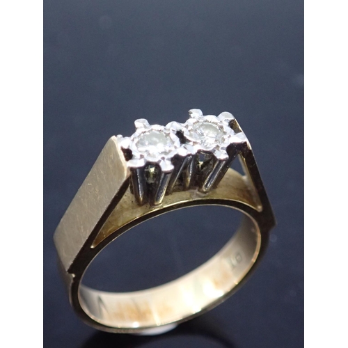 60 - A diamond two stone ring set in 18ct gold finger size N approx. 6.1 grams