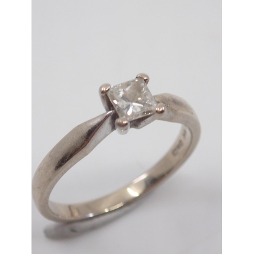 7 - An 18ct white gold diamond solitaire ring set finger size I half