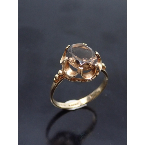 103 - A 9ct gold topaz set ring, showing as finger size M