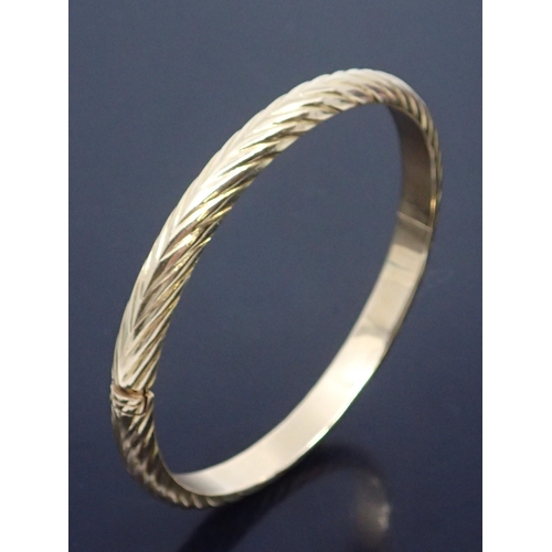 116 - A 14kt gold bangle approx. 17.6 grams