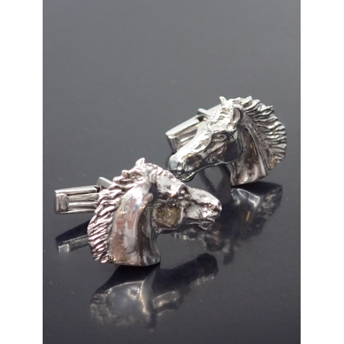 118 - A pair of heavy horse head 18ct gold cufflinks signed West approx. 40 grams