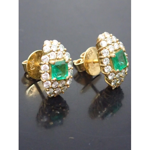 121 - A pair of emerald and diamond cluster earrings set in 18ct gold