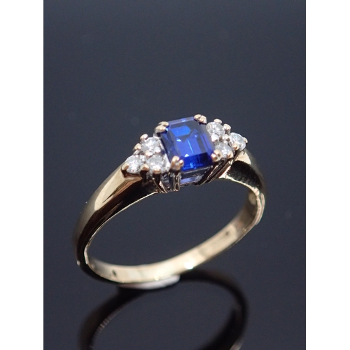 128 - A sapphire and diamond cluster ring set in 9ct gold approx. 2 grams