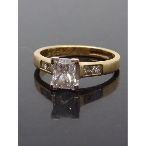 134 - A princess cut diamond solitaire ring set with diamond shoulders finger size L half, estimated weigh... 