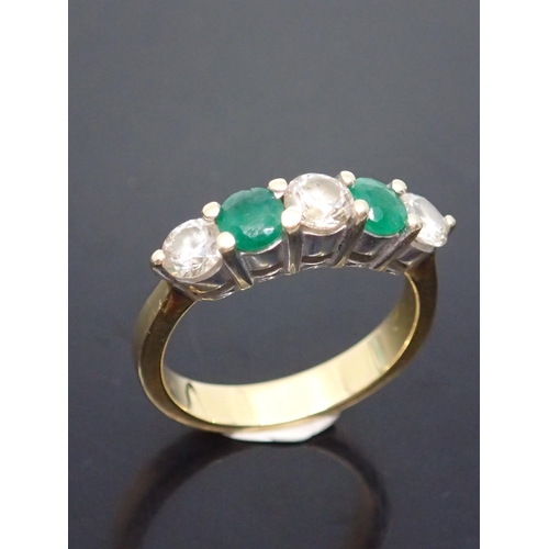 136 - An emerald and diamond five stone ring set in 18ct gold finger size L half