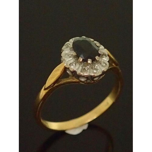 138 - A sapphire and diamond cluster ring approx. 3 grams set in 18ct gold finger size J half