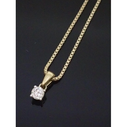 142 - A diamond set  9ct gold pendant on chain approx. 3 grams (yellow gold)