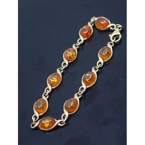 157 - A 9ct gold Amber bracelet