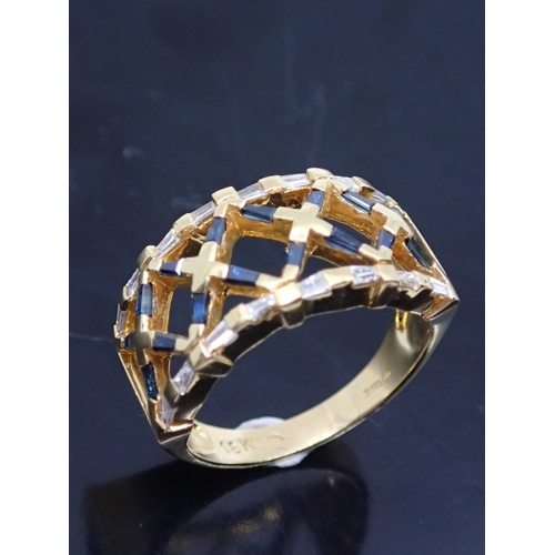 164 - An 18ct gold diamond and sapphire ring, showing as finger size P and a half