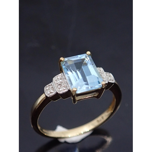 165 - A diamond and blue gem set ring, showing as finger size K and a half