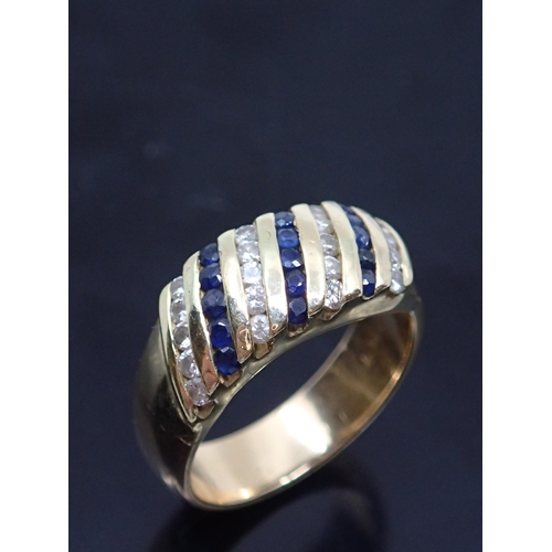 167 - A 14kt gold diamond and sapphire ring, showing as finger size M/N