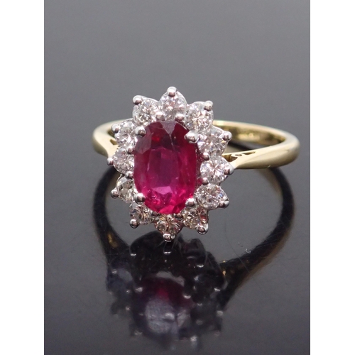 173 - A ruby and diamond cluster ring set in 18ct gold with a copy of a valuation from Weir & Sons which s... 