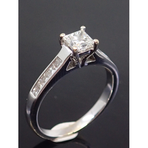 183 - A diamond solitaire ring set with diamond shoulders estimated weight of main diamond 0.50cts colour ... 