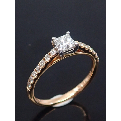 184 - A diamond solitaire ring set with diamond shoulders set in rose gold and platinum estimated weight o... 