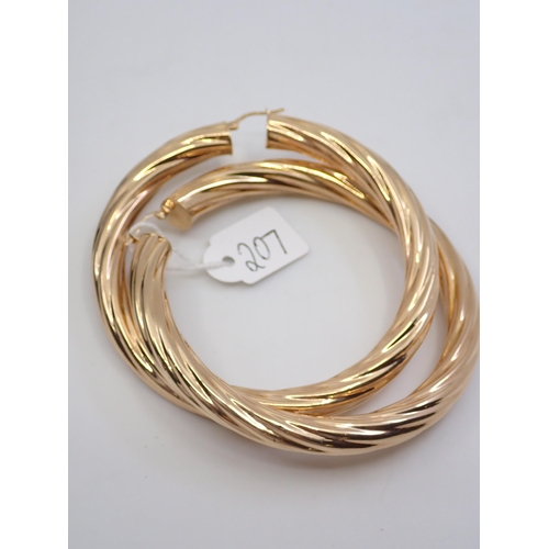 207 - A pair of large gold hoop earrings approx. 16.9 grams